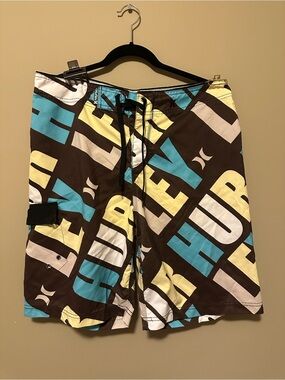 Vintage Hurley Men’s Brown Swim Board Shorts with Blue & Yellow Graphic